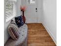 Foyer features wood flooring, a cushioned bench, and neutral decor at 1393 Halpern Nw Ln, Kennesaw, GA 30144
