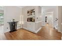 Dining room with hardwood floors, a built-in bar area, and a view into the kitchen for easy serving at 2622 Murdock Rd, Marietta, GA 30062