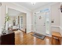 Bright foyer featuring hardwood floors, a white front door, and views into the adjacent living spaces at 2622 Murdock Rd, Marietta, GA 30062