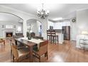 An open dining room boasts a chandelier, hardwood floors and flows into the kitchen and living room at 989 Brownstone Ln # 16, Marietta, GA 30008