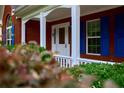 Welcoming front entrance with white door, sidelights, and charming porch, offering a warm greeting at 1847 Oak Rd, Snellville, GA 30078