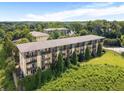 Aerial view of a multi-story apartment complex showing the ample lawn and neighborhood at 1195 Milton Se Ter # 1407, Atlanta, GA 30315