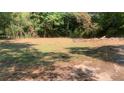 Cleared grassy lot with scattered trees, ready for construction or landscaping projects at 3443 Estes Dr, South Fulton, GA 30349