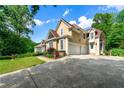 Spacious home with a large driveway and a three car garage at 5309 Ashley Trce, Atlanta, GA 30360