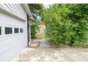 View of the side yard and garage, with potential for landscaping or outdoor activities at 5697 Brooklyn Ln, Norcross, GA 30093