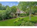 Charming home with brick and stone accents, lush landscaping, and a walkway to the front door at 2840 Astoria Ave, Cumming, GA 30040