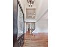 Grand foyer entrance with hardwood floors, chandelier, and soaring ceilings at 414 Candler Trl, Canton, GA 30115