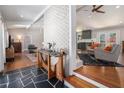 Inviting home interior showcasing a stylish blend of slate, hardwood, and painted brick at 4469 Huntington Cir, Atlanta, GA 30338