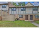 Inviting townhouse with well-maintained lawn, showing classic brick facade and cozy neighborhood ambiance at 1150 Rankin St # 19O, Stone Mountain, GA 30083
