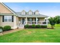 Inviting home exterior with dormer windows and a welcoming front porch at 137 Cambridge Pointe, Villa Rica, GA 30180