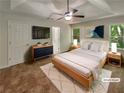 Bedroom with windows and a ceiling fan at 575 Freeman Dr, Covington, GA 30016