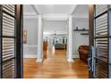 Inviting foyer features hardwood floors, stately columns, and an open view to the living spaces at 1255 Beech Haven Ne Rd, Atlanta, GA 30324