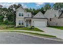Charming two-story home featuring a manicured lawn and a two-car garage at 2505 Whistler Way Ne, Lawrenceville, GA 30043