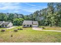 Traditional-style home featuring lush lawn, attached garage and separate oversized garage at 267 Rocky Point Rd, Covington, GA 30014