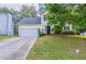 Charming two-story home with a well-manicured front yard and attached two-car garage at 3075 Oakvale Hts, Decatur, GA 30034
