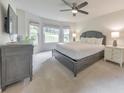 Serene bedroom with large windows, neutral tones, and ample space for a relaxing retreat at 138 Hartwood Dr, Woodstock, GA 30189