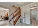 Inviting entryway features staircase, stylish decor, and durable wood-look flooring at 1486 Maple Ridge Dr, Suwanee, GA 30024
