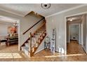 Inviting foyer featuring beautiful hardwood floors, staircase, and flows to the dining room at 1486 Maple Ridge Dr, Suwanee, GA 30024