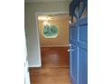 Inviting entryway with hardwood floors and a view into a sunlit living area at 604 Pepperwood Ln, Stone Mountain, GA 30087