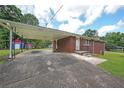 Spacious carport attached to a brick home, providing ample parking and covered entry at 629 Birchwood Rd, Marietta, GA 30060