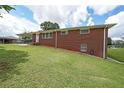 Charming brick home with a well-maintained lawn and easy access to the carport at 629 Birchwood Rd, Marietta, GA 30060