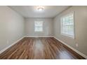 Comfortable bedroom with natural light and wood flooring at 3731 Adkins Nw Rd, Atlanta, GA 30331