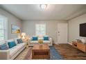 Inviting living room with hardwood floors, ample natural light, and stylish contemporary furnishings at 3731 Adkins Nw Rd, Atlanta, GA 30331