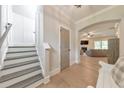 Bright foyer with hardwood floors, staircase, and views into the living room at 4230 Old Cherokee St, Acworth, GA 30101