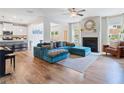 Spacious living room with hardwood floors, fireplace, and plenty of natural light at 1048 Shadow Glen Dr, Fairburn, GA 30213