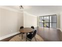 Bright dining area features hardwood floors and a large window, creating an inviting space to enjoy meals at 1280 W Peachtree Nw St # 1013, Atlanta, GA 30309