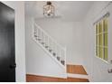 Bright foyer showcases hardwood floors and a staircase with white wooden banister at 1380 Heritage Glen Dr, Marietta, GA 30068