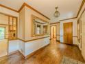 Entry foyer with hardwood floors, a large mirror, and views into other living spaces at 3809 Cotswold Sw Dr, Lilburn, GA 30047