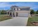 Beautiful two-story home featuring a spacious driveway and a well-manicured lawn at 281 Chiswick Loop, Stockbridge, GA 30281