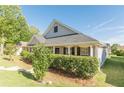 Well-maintained home with classic design elements and lush green lawn at 363 Chadwick Cmn, Stockbridge, GA 30281