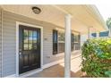 Inviting covered porch with elegant columns and a stylish front door at 363 Chadwick Cmn, Stockbridge, GA 30281