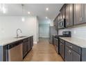 Galley style kitchen offers granite countertops and stainless steel appliances at 4183 May Apple Ln, Atlanta, GA 30349