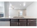 Beautiful kitchen island with stainless steel dishwasher and undermount sink at 4183 May Apple Ln, Atlanta, GA 30349