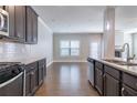 Modern kitchen featuring stainless steel appliances and granite countertops at 4183 May Apple Ln, Atlanta, GA 30349
