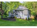 Spacious home showcasing the yard, landscaping, mature trees, and stylish exterior at 288 Shire Way, Lawrenceville, GA 30044
