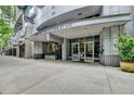 Contemporary building entrance at 930 West Peachtree St NW with glass doors and modern architecture at 950 W Peachtree Nw St # 911, Atlanta, GA 30309