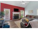 A beautifully designed living room with a stone fireplace, ample seating, and neutral decor at 100 Sydney Smt, Villa Rica, GA 30180