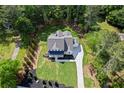 An aerial view highlighting the spacious lot, driveway, and pristine landscaping surrounding this lovely home at 10350 Alvin Rd, Johns Creek, GA 30022