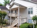 Exterior elevation showcasing covered front porch and beautiful landscaping at 904 Bridge Se Ln, Smyrna, GA 30082