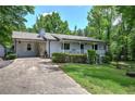 Attractive single-story house with stone accents, a quaint front porch, and a well-manicured lawn at 1095 Dallas Nebo Rd, Dallas, GA 30157