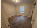 A carpeted bedroom offering a peaceful retreat at 4718 City View Dr, Forest Park, GA 30297