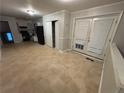 Eat in kitchen featuring neutral tile, storage, and access to a rear exterior at 4718 City View Dr, Forest Park, GA 30297