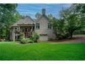 View of the back of the house with a deck, patio, and walkout basement at 118 Whitestone Dr, Mcdonough, GA 30253