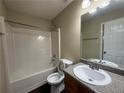Full bathroom featuring a shower-tub combination, white toilet and single sink vanity at 257 Juliet Dr, Hampton, GA 30228