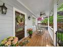 Charming front porch with rocking chairs, decorative wreath, and warm lighting, perfect for relaxing outdoors at 66 Mobile Ne Ave, Atlanta, GA 30305