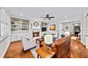 Cozy living room with built-in bookshelves, fireplace, and hardwood floors, perfect for entertaining at 66 Mobile Ne Ave, Atlanta, GA 30305